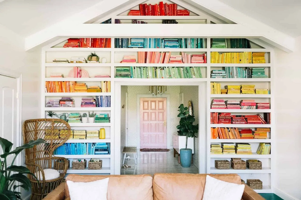 how to style a bookcase rainbow books