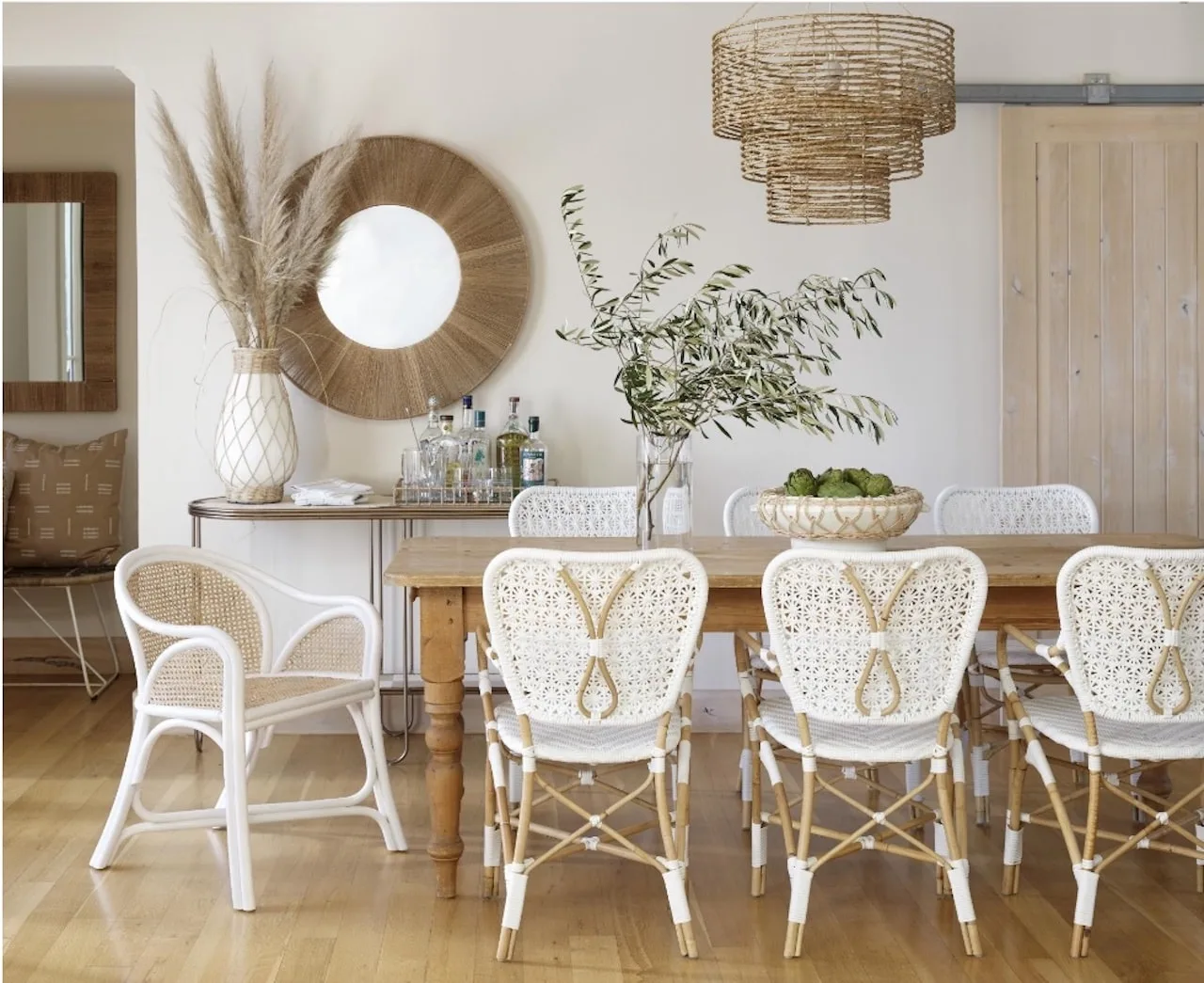 Boho Meets Beach: How to Design the Coastal Boho Interior of Your Dreams 12 coastal boho interior beach design dining room wicker chairs