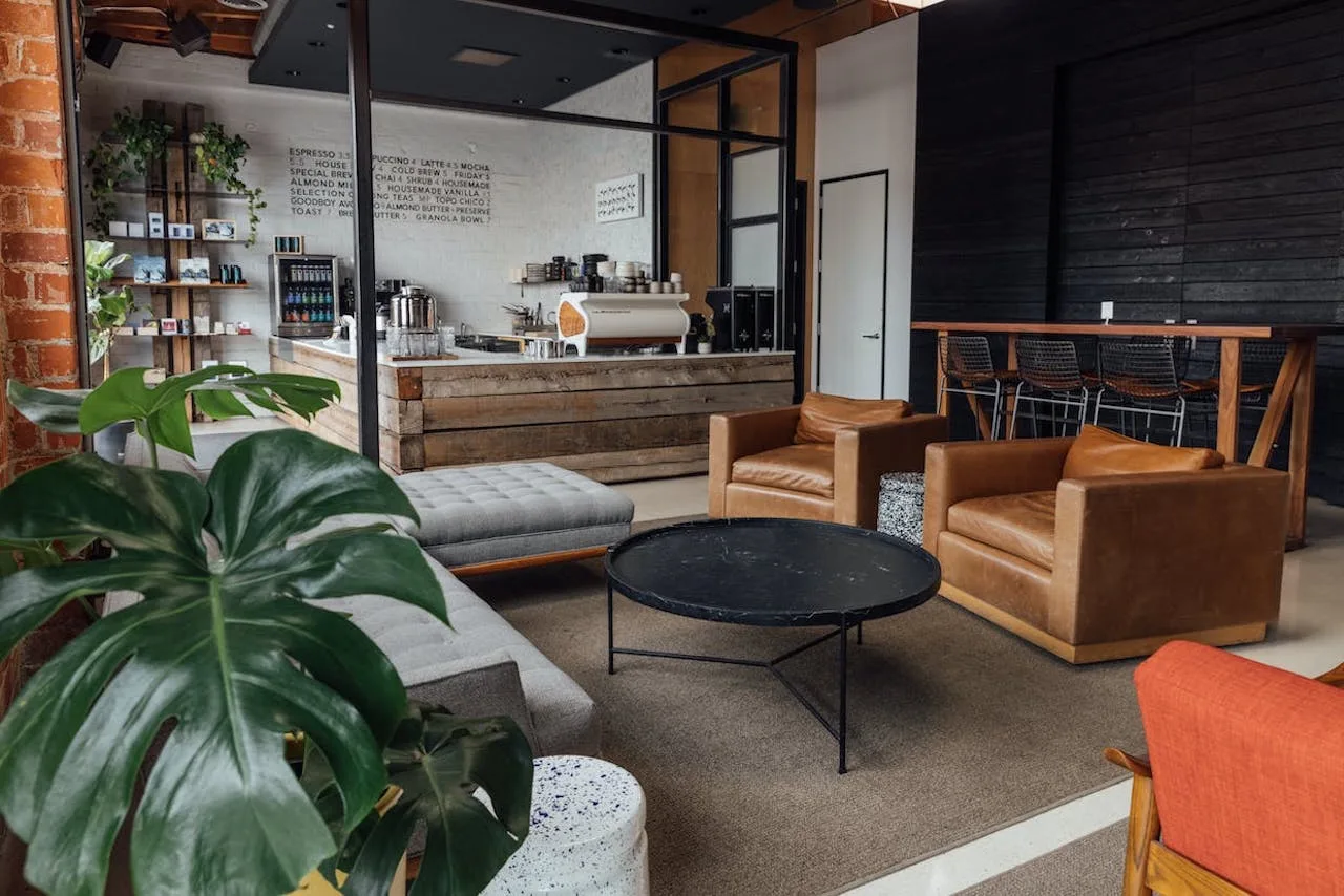 11 Aesthetic Coffee Shop Decor Ideas That'll Keep Customers Coming Back 6 coffee shop decor ideas cozy leather chairs