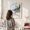 Framed Acadia National Park Watercolor Wall Art - In Living Room with Woman Looking at it - Portrait