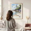 Framed Acadia National Park Watercolor Wall Art - In Living Room with Woman Looking at it - Portrait