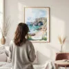 Framed Algarve Portugal Watercolor Wall Art - In Living Room with Woman Looking at it - Portrait