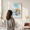 Framed Amritsar Golden Temple Watercolor Wall Art - In Living Room with Woman Looking at it - Portrait