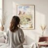Framed Arizona Watercolor Wall Art - In Living Room with Woman Looking at it - Portrait