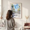 Framed Barcelona Las Ramblas Watercolor Wall Art - In Living Room with Woman Looking at it - Portrait