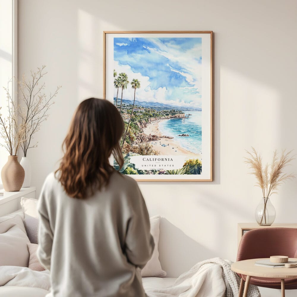 Framed California Laguna Beach Watercolor Wall Art - In Living Room with Woman Looking at it - Portrait Framed California Laguna Beach Watercolor Wall Art - In Living Room with Woman Looking at it - Portrait