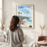 Framed California Laguna Beach Watercolor Wall Art - In Living Room with Woman Looking at it - Portrait
