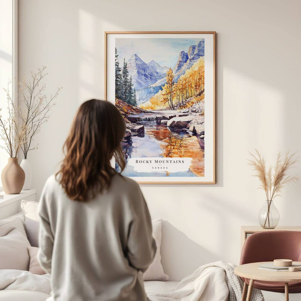 Framed Canadian Rocky Mountains Watercolor Wall Art - In Living Room with Woman Looking at it - Portrait Framed Canadian Rocky Mountains Watercolor Wall Art - In Living Room with Woman Looking at it - Portrait