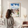 Framed Canyonland Watercolor Wall Art - In Living Room with Woman Looking at it - Portrait