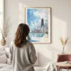 Framed Chicago Skyline Watercolor Wall Art - In Living Room with Woman Looking at it - Portrait