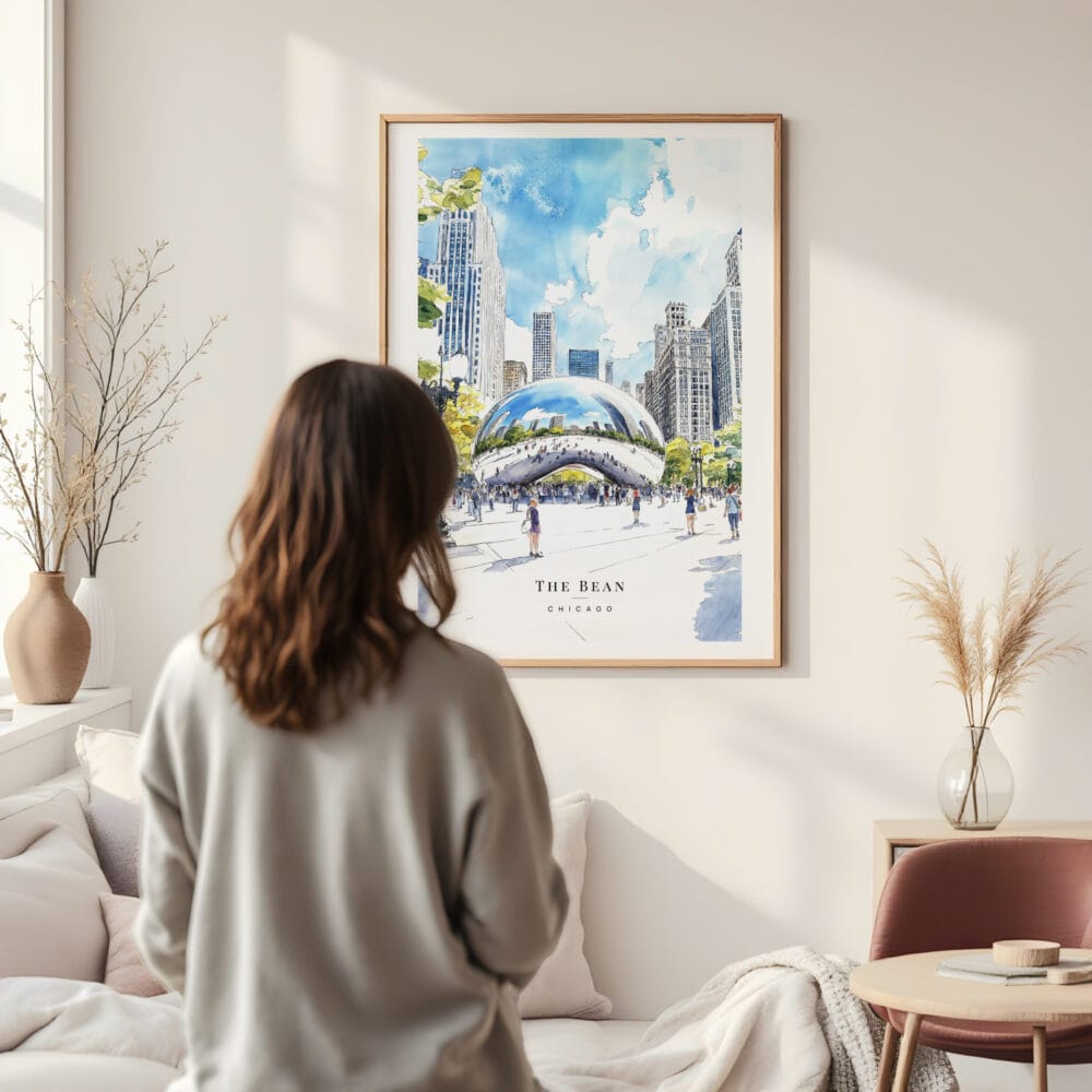 Framed Chicago The Bean Cloud Gate Watercolor Wall Art - In Living Room with Woman Looking at it - Portrait Framed Chicago The Bean Cloud Gate Watercolor Wall Art - In Living Room with Woman Looking at it - Portrait