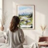 Framed Denali National Park Watercolor Wall Art - In Living Room with Woman Looking at it - Portrait