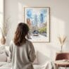 Framed Downtown Philadelphia Watercolor Wall Art - In Living Room with Woman Looking at it - Portrait