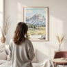 Framed Grand Teton Watercolor Wall Art - In Living Room with Woman Looking at it - Portrait