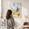 Framed Isle of Skye Watercolor Wall Art - In Living Room with Woman Looking at it - Portrait
