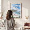 Framed Laguna Beach Coast Watercolor Wall Art - In Living Room with Woman Looking at it - Portrait