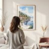 Framed Lake Como Watercolor Wall Art - In Living Room with Woman Looking at it - Portrait