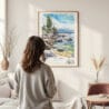 Framed Lake Tahoe Watercolor Wall Art - In Living Room with Woman Looking at it - Portrait