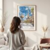 Framed Las Vegas Watercolor Wall Art - In Living Room with Woman Looking at it - Portrait