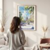Framed Madison Wisconsin Capital Building Watercolor Wall Art - In Living Room with Woman Looking at it - Portrait