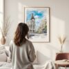 Framed Madrid Watercolor Wall Art - In Living Room with Woman Looking at it - Portrait