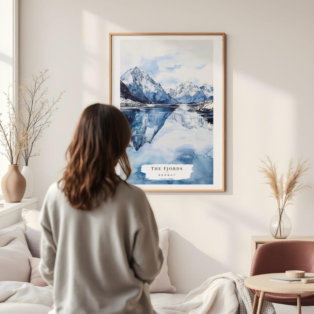Framed Norwegian Fjords in Winter Watercolor Wall Art - In Living Room with Woman Looking at it - Portrait Framed Norwegian Fjords in Winter Watercolor Wall Art - In Living Room with Woman Looking at it - Portrait