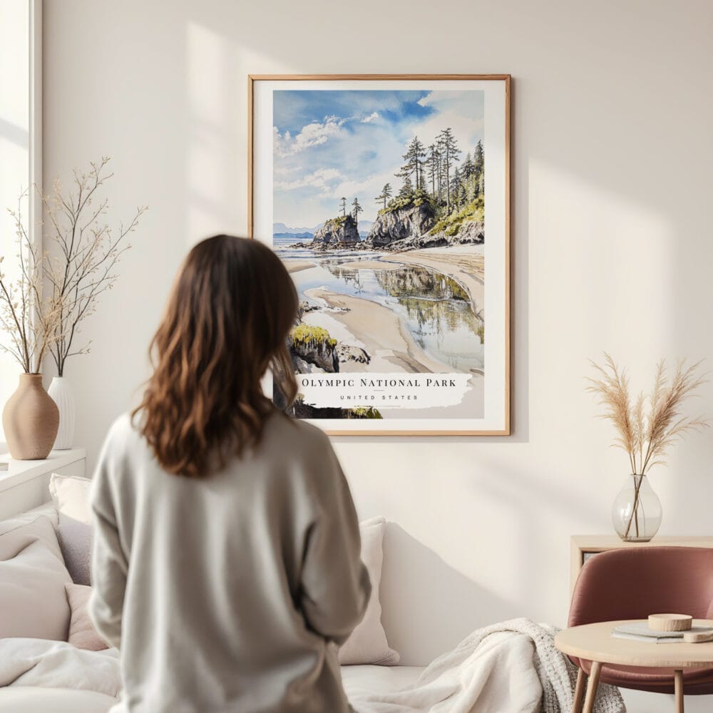 Framed Olympic National Park Rialto Beach Watercolor Wall Art - In Living Room with Woman Looking at it - Portrait Framed Olympic National Park Rialto Beach Watercolor Wall Art - In Living Room with Woman Looking at it - Portrait
