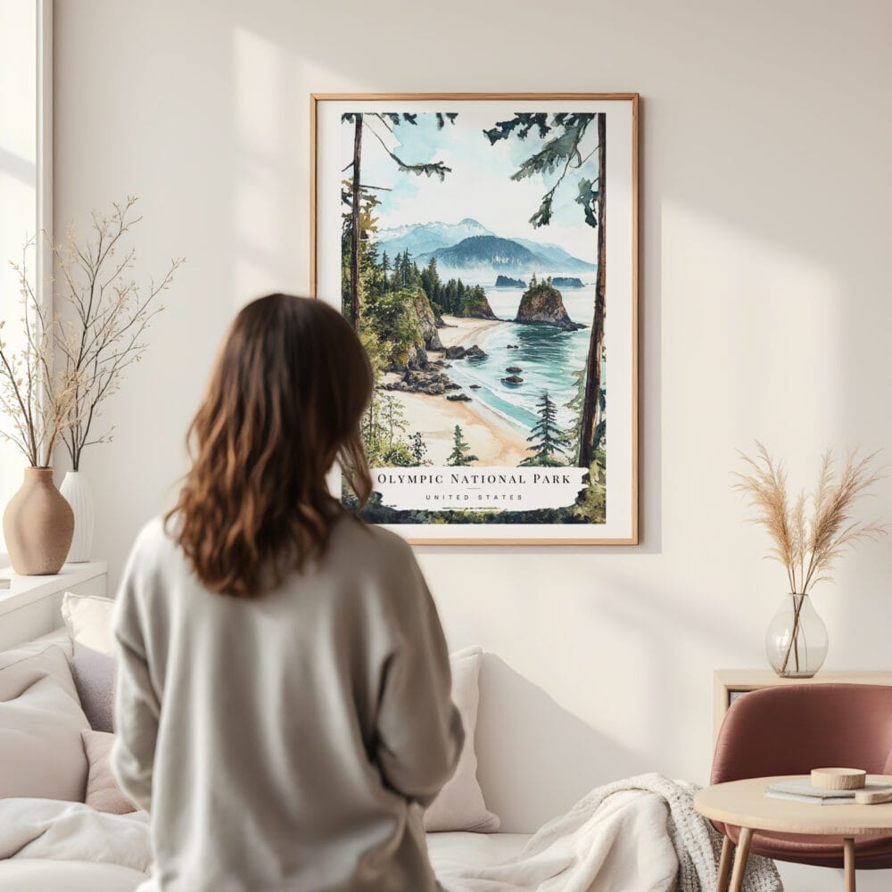 Framed Olympic National Park Watercolor Wall Art - In Living Room with Woman Looking at it - Portrait Framed Olympic National Park Watercolor Wall Art - In Living Room with Woman Looking at it - Portrait