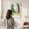 Framed Redwood California National Park Watercolor Wall Art - In Living Room with Woman Looking at it - Portrait