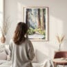 Framed Redwood National Park Watercolor Wall Art - In Living Room with Woman Looking at it - Portrait