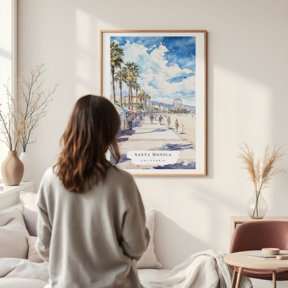 Framed Santa Monica Watercolor Wall Art - In Living Room with Woman Looking at it - Portrait Framed Santa Monica Watercolor Wall Art - In Living Room with Woman Looking at it - Portrait