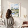 Framed Scottish Highlands Watercolor Wall Art - In Living Room with Woman Looking at it - Portrait