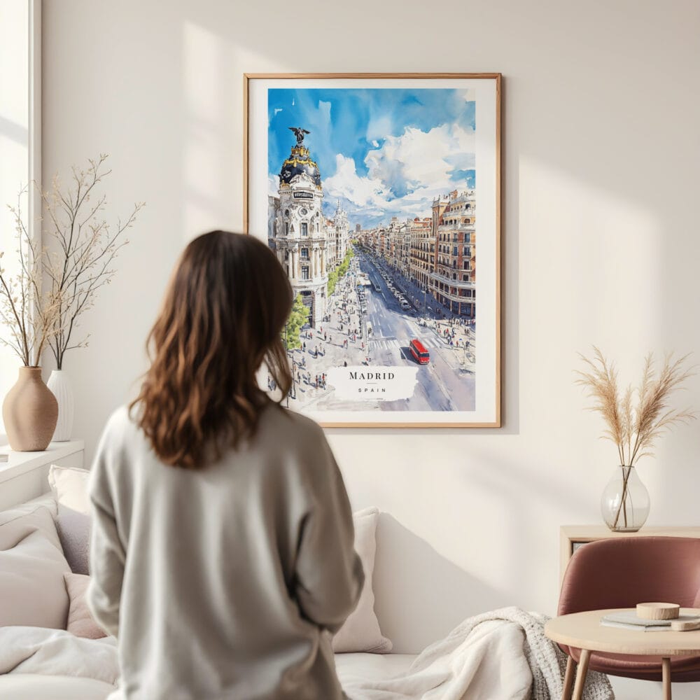 Framed Spain Madrid Watercolor Wall Art - In Living Room with Woman Looking at it - Portrait Framed Spain Madrid Watercolor Wall Art - In Living Room with Woman Looking at it - Portrait