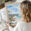 Woman Holding Framed California Laguna Beach Watercolor Wall Art - Portrait