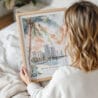 Woman Holding Framed Miami Florida Sunset Watercolor Wall Art - Portrait
