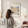 Framed Death Valley Watercolor Wall Art - In Living Room with Woman Looking at it - Portrait