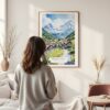 Framed Grindelwald Switzerland Watercolor Wall Art - In Living Room with Woman Looking at it - Portrait