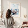 Framed Hong Kong Watercolor Wall Art - In Living Room with Woman Looking at it - Portrait