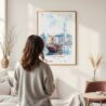 Framed Hong Kong Watercolor Wall Art - In Living Room with Woman Looking at it - Portrait