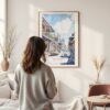 Framed New Orleans Bourbon Street Watercolor Wall Art - In Living Room with Woman Looking at it - Portrait