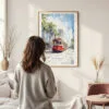 Framed New Orleans Canal Street Watercolor Wall Art - In Living Room with Woman Looking at it - Portrait