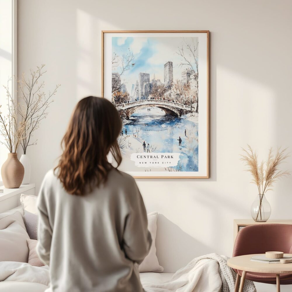 Framed New York City Central Park Watercolor in Winter Wall Art - In Living Room with Woman Looking at it - Portrait Framed New York City Central Park Watercolor in Winter Wall Art - In Living Room with Woman Looking at it - Portrait