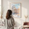 Framed Rome Colosseum Watercolor Wall Art - In Living Room with Woman Looking at it - Portrait
