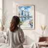 Framed Singapore Watercolor Wall Art - In Living Room with Woman Looking at it - Portrait
