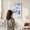 Framed Skiing in Grindelwald Watercolor Wall Art - In Living Room with Woman Looking at it - Portrait