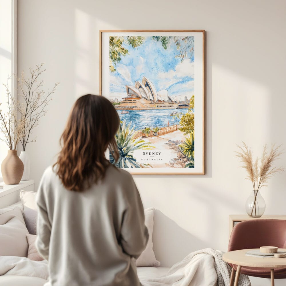 Framed Sydney Opera House Watercolor Wall Art - In Living Room with Woman Looking at it - Portrait Framed Sydney Opera House Watercolor Wall Art - In Living Room with Woman Looking at it - Portrait