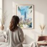 Framed Taipei Watercolor Wall Art - In Living Room with Woman Looking at it - Portrait
