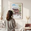 Framed Tokyo Asakusa Watercolor Wall Art - In Living Room with Woman Looking at it - Portrait
