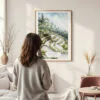 Framed Ubud Bali Watercolor Wall Art - In Living Room with Woman Looking at it - Portrait