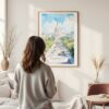 Framed Washington DC Watercolor Wall Art - In Living Room with Woman Looking at it - Portrait
